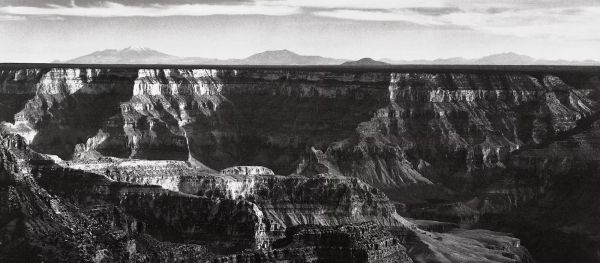 Book cover of Ansel Adams: The National Park Service Photographs, featuring the American National park with winding river and mountains behind. Published by Abbeville Press.