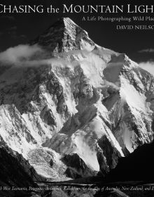 Book cover of Chasing the Mountain Light: A Life Photographing Wild Places, with a snow covered mountain landscape. Published by Abbeville Press.