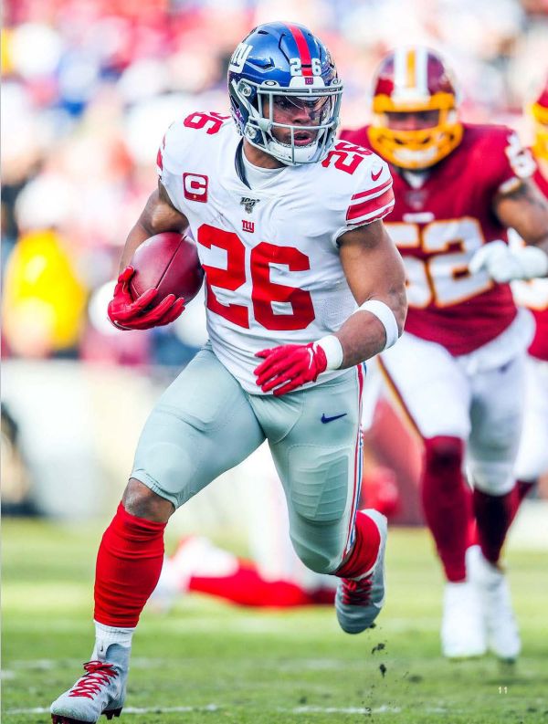 Book cover of Stars of the NFL, with three American footballers, including Patrick Mahomes, in action on the pitch. Published by Abbeville Press.