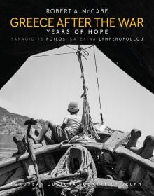 Young boy sitting on bow of boat, on cover of 'Greece After the War, Years of Hope', by Abbeville Press.