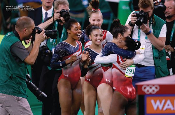 Book cover of Legends of Women's Gymnastics, with American gymnast Simone Biles wearing sparkly red leotard, performing splits in air. Published by Abbeville Press.