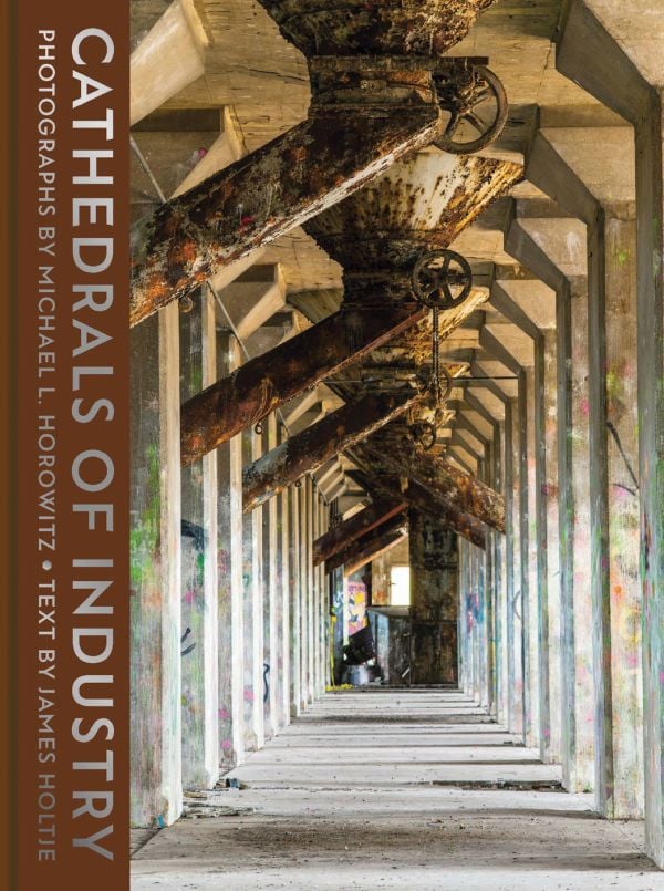 Book cover of Cathedrals of Industry: Exploring the Factories and Infrastructure That Made America, with an interior of grain elevator in Buffalo. Published by Abbeville Press.