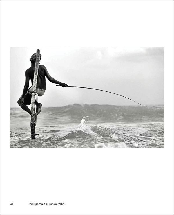 Book cover of Collecting the World, featuring a photo capturing a figure jumping off edge of brick structure into sea below. Published by Hurtwood Press Ltd.