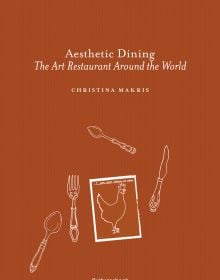 Rich brown cover with white illustrations of fork, knife, 2 spoons and a page with a chicken and Aesthetic Dining The Art Restaurant Around the World in white font