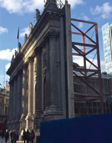 Book cover of The Gentle Author's The Creeping Plague of Ghastly Facadism, with front of brick building with windows. Published by Spitalfields Life Books Ltd.