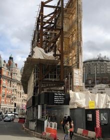 Book cover of The Gentle Author's The Creeping Plague of Ghastly Facadism, with front of brick building with windows. Published by Spitalfields Life Books Ltd.