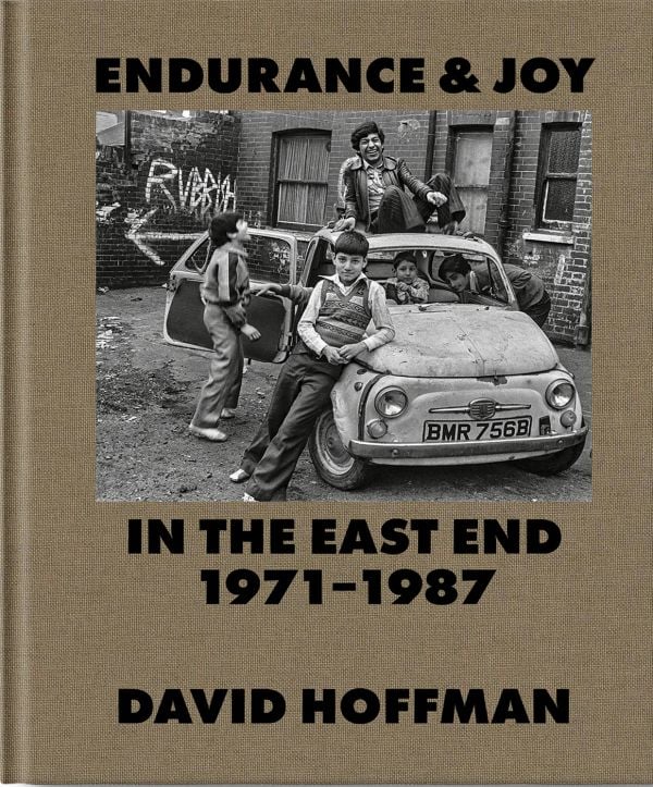 Book cover of Endurance & Joy in the East End 1971-87, with British Bengali children sitting on a car outside of a squat near Brick Lane. Published by Spitalfields Life Books.