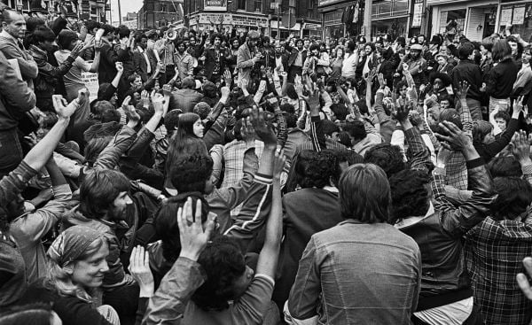 Book cover of Endurance & Joy in the East End 1971-87, with British Bengali children sitting on a car outside of a squat near Brick Lane. Published by Spitalfields Life Books.
