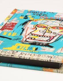Graffiti artwork 'Skulls (Mitchell Crew)' by Jean-Michel Basquiat, to notebook cover, by teNeues stationery.