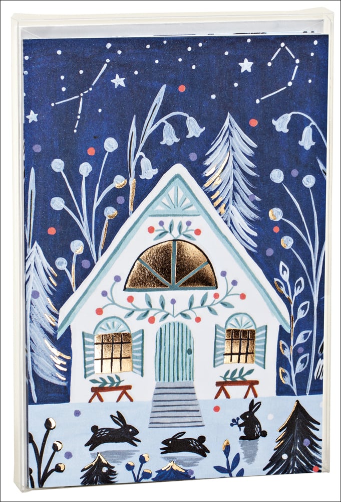 Flora Waycott's winter cabin in snow with gold window, on notecard, by teNeues stationery.