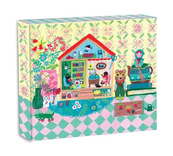 Notecard box of We Are Family QuickNotes, with a bear dressed in yellow striped dungarees, next to house with two moles sitting in chairs. Published by teNeues Stationery.