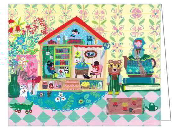 Notecard box of We Are Family QuickNotes, with a bear dressed in yellow striped dungarees, next to house with two moles sitting in chairs. Published by teNeues Stationery.