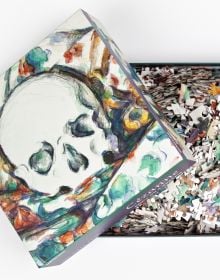 Puzzle box cover of Paul Cezanne, Skull on a Curtain 1000-Piece Puzzle, featuring the artist's 'Skull on a Curtain' artwork. Published by teNeues Stationery.