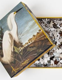 Puzzle box of Snowy Egret, James Audubon 1000-Piece Puzzle, with painting of bird. Published by teNeues Stationery.