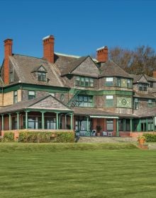 John Carter Brown Italianate villa with green buxus hedges, on cover of 'Newport Cottages 1835-1890, The Summer Villas Before the Vanderbilt Era', by Bauer and Dean Publishers.