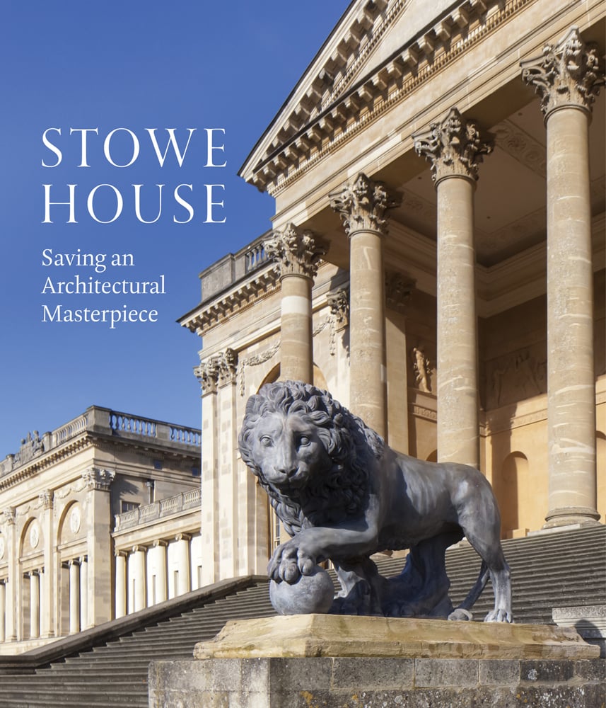 Steps up to Stowe House with bronze Lion statue in foreground, Stowe House in white font on blue sky