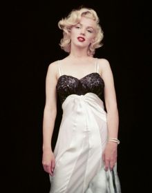 Marilyn Monroe - Negligee Sitting, by Milton H. Greene, on black cover of 'The Essential Marilyn Monroe', by ACC Art Books.