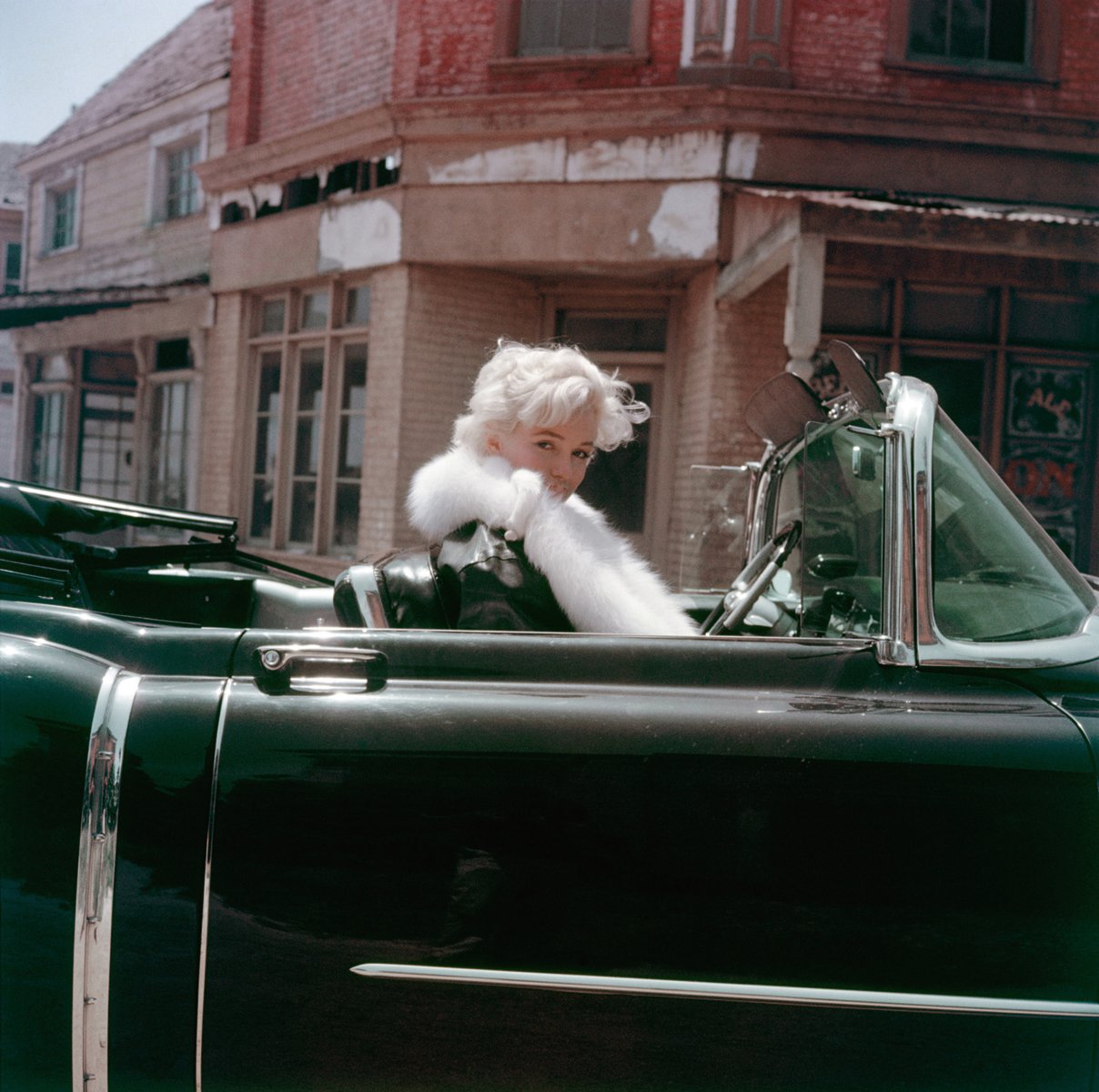 Marilyn Monroe - Negligee Sitting, by Milton H. Greene, on black cover of 'The Essential Marilyn Monroe', by ACC Art Books.