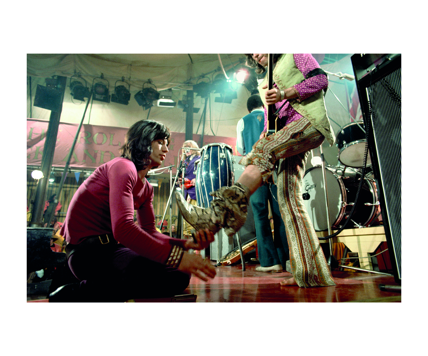 'STONES' in stencilled font with Rolling Stones members behind, on red cover of 'Stones From the Inside – The Limited Edition, Rare and Unseen Images', by ACC Art Books.