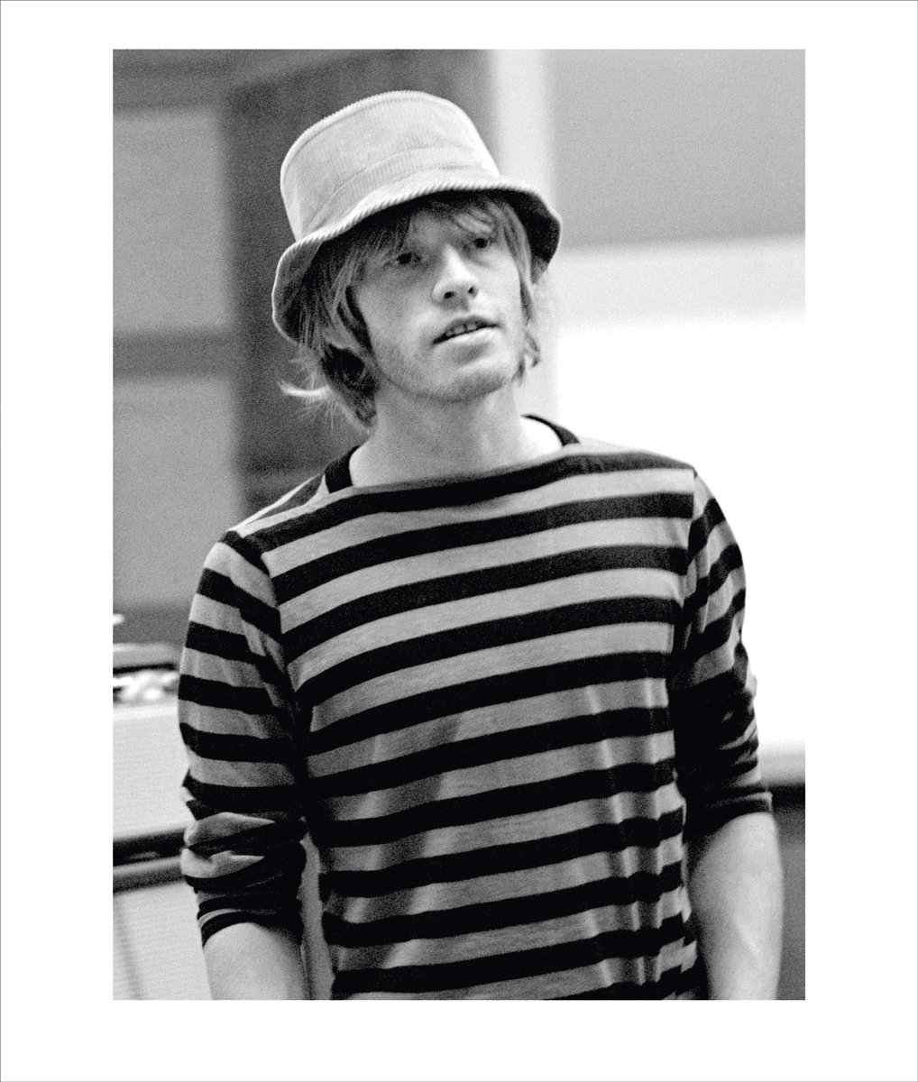 STONES with a colour backstage shot of Mick Jagger, black and white text From the Inside: Rare and Unseen Images