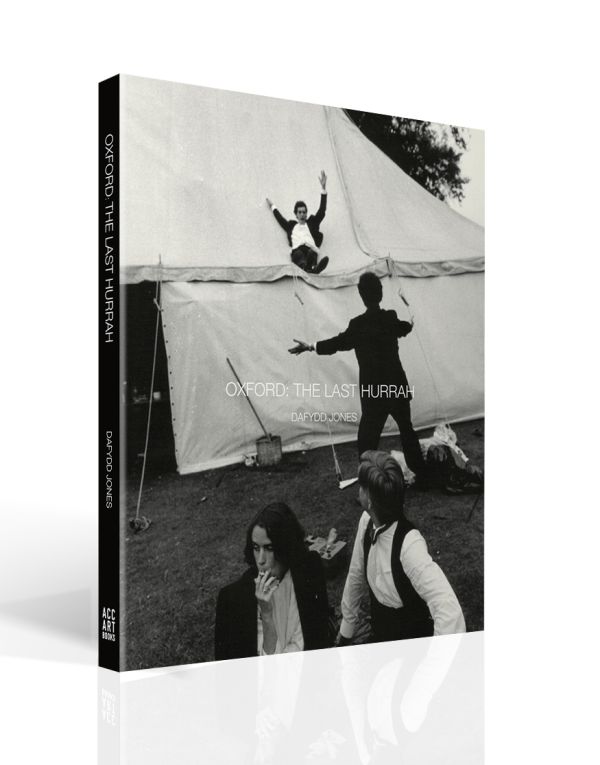 Book cover of 'Oxford The Last Hurrah, with a photo titled 'Sliding Down The Marquee, New College Ball, 1983' by Dafyyd Jones. Published by ACC Art Books.