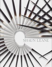 Book cover of Shaun Leane, with a large metal and wood spike ear cuff. Published by ACC Art Books.
