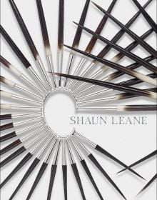Book cover of Shaun Leane, with a spiked metal and wood ear cuff. Published by ACC Art Books.