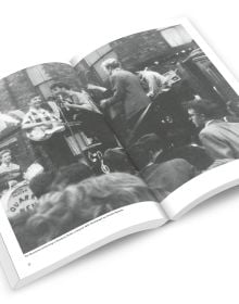 The Beatles jumping in air, on yellow cover of 'The Beatles: Fab Four Cities, Liverpool - Hamburg - London - New York', by ACC Art Books.