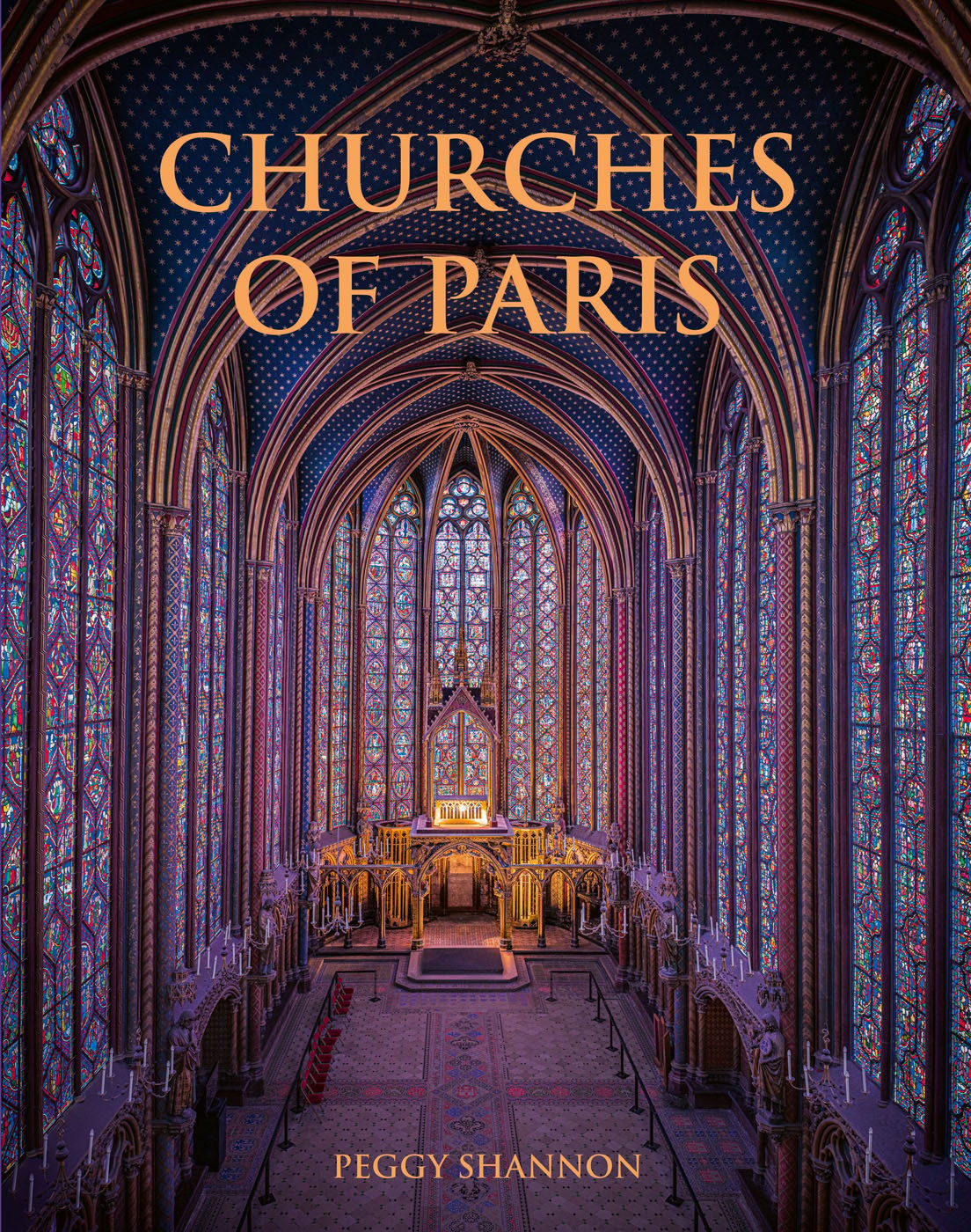 Gothic interior of Sainte-Chapelle in Paris, stained glass windows with fleurs de lys ceiling decoration, to cover of Churches of Paris.