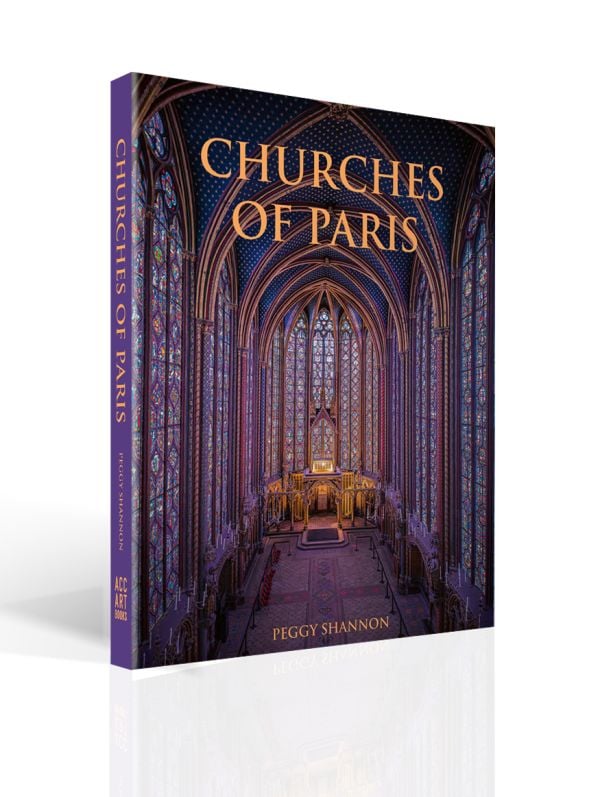 Book cover of Churches of Paris, featuring the atmospheric gothic interior of Sainte-Chapelle in Paris, and stained glass windows with fleurs de lys ceiling decoration. Published by ACC Art Books.