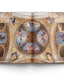 Book cover of Churches of Paris, featuring the atmospheric gothic interior of Sainte-Chapelle in Paris, and stained glass windows with fleurs de lys ceiling decoration. Published by ACC Art Books.