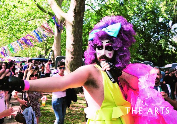 Book cover of Queer Londo: A Guide to the City’s LGBTQ+ Past and Present, with a LGBT rainbow flag painted to top edge of brick building. Published by ACC Art Books.