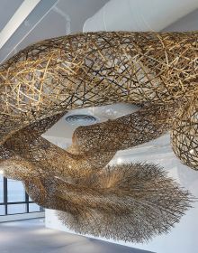 Large wave-like bamboo installation sculpture, on cover of 'Tanabe Chikuunsai IV Masterpieces in Bamboo', by ACC Art Books.