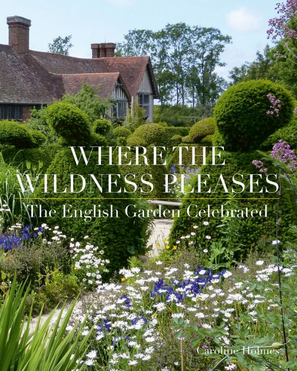 Book cover of Where the Wildness Pleases, featuring a the Tudor house of Great Dixter, with Art and Crafts garden. Published by ACC Art Books.