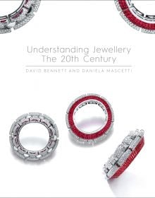 Luxury diamond and ruby jewelled bangles, on white cover of 'Understanding Jewellery, The 20th Century', by ACC Art Books.