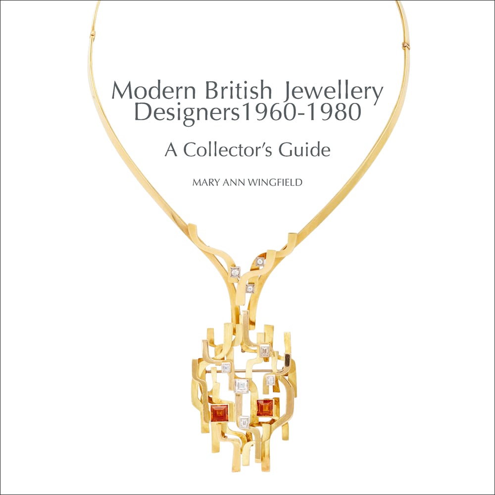 White cover with a colour photograph of a long gold necklace with diamond and amber jewels with Modern British Jewellery Designers 1960-1980 A Collector’s Guide in grey by ACC Art Books