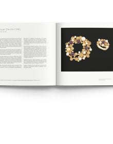 18ct gold citrine and diamond collar pendant necklace, on white cover of 'Modern British Jewellery Designers 1960-1980', by ACC Art Books.