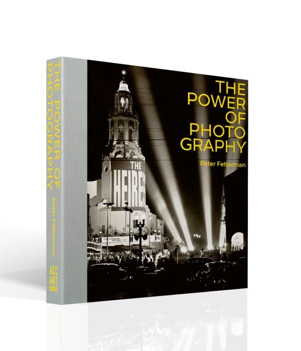 Book cover of The Power of Photography, featuring a premiere at Carthay Circle, Los Angeles in 1949, with floodlights illuminating the night sky. Published by ACC Art Books.