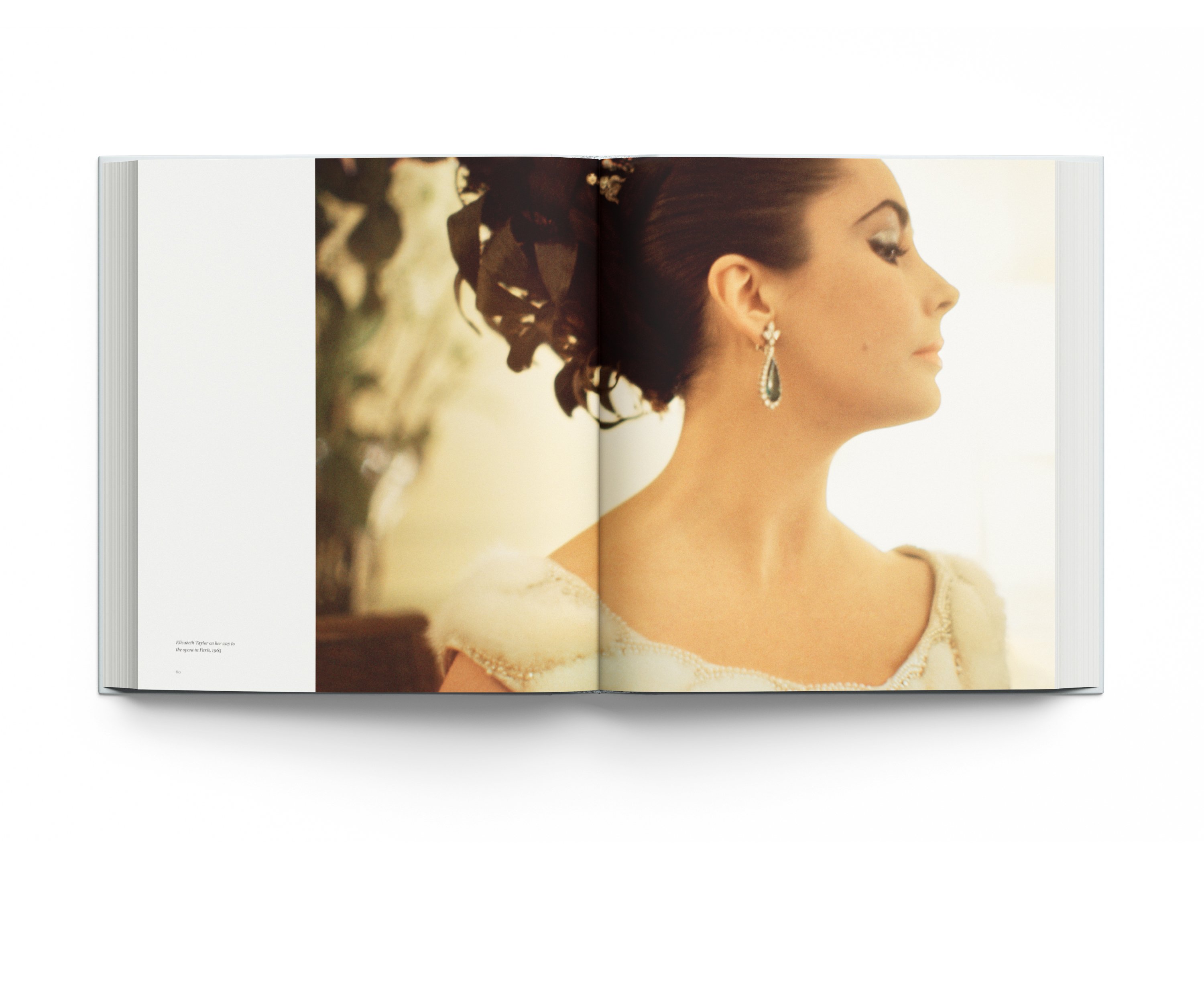 Book cover of Forever Elizabeth, Iconic Photographers on a Legendary Star, featuring a captivating close up of a blue-eyed Elizabeth Taylor. Published by ACC Art Books.