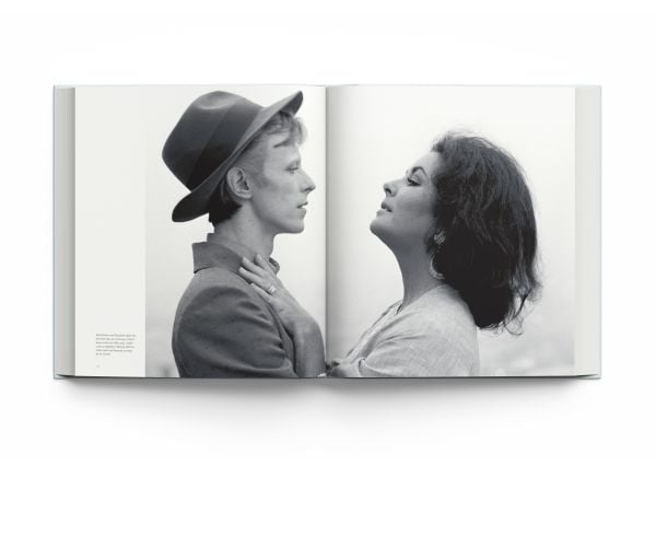 Book cover of Forever Elizabeth, Iconic Photographers on a Legendary Star, featuring a captivating close up of a blue-eyed Elizabeth Taylor. Published by ACC Art Books.