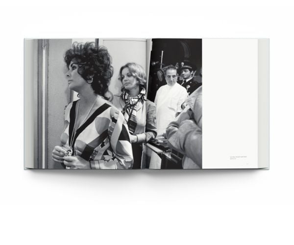 Book cover of Forever Elizabeth, Iconic Photographers on a Legendary Star, featuring a captivating close up of a blue-eyed Elizabeth Taylor. Published by ACC Art Books.