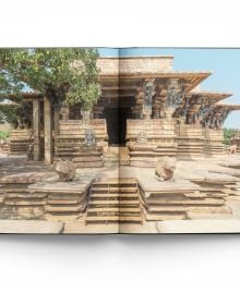 Book cover of Temples of Deccan India, featuring the carved interior of Deccan temple, with a shrine visible through a doorway. Published by ACC Art Books.