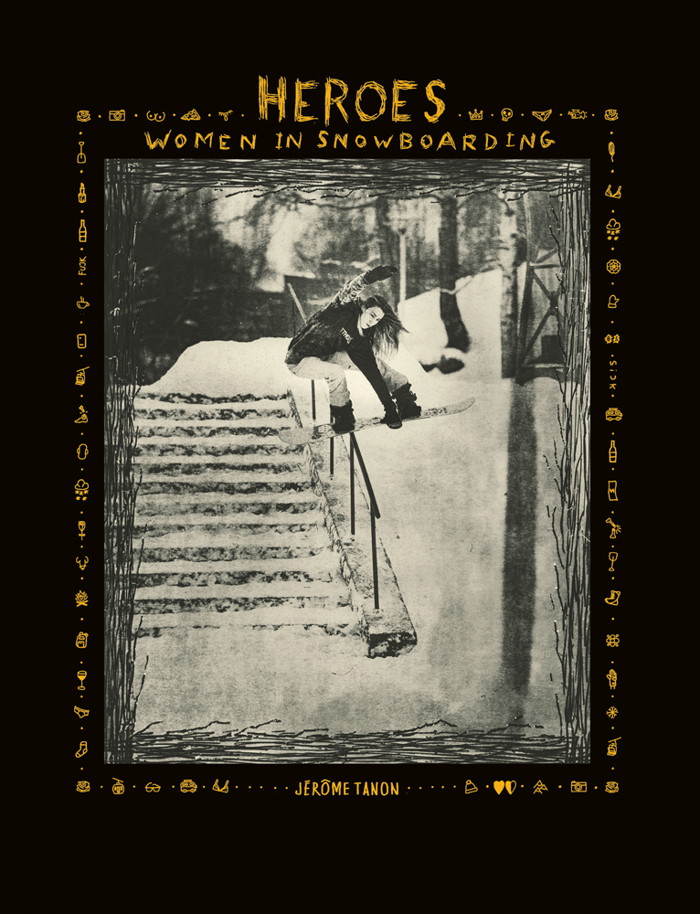 Black cover with a full length black and white action photograph of a snowboarder sliding down a handrail above snow covered steps with Heroes Women in Snowboarding in yellow by ACC Art Books