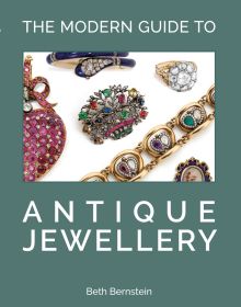 Collection of antique jewellery pieces on sage cover of 'The Modern Guide to Antique Jewellery, Beth Bernstein', by ACC Art Books.