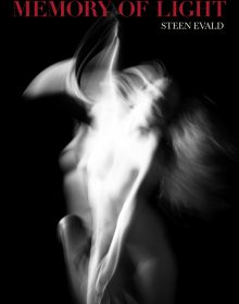 Blurred female nude in movement, on black cover of 'Memory of Light, Steen Evald', by ACC Art Books.