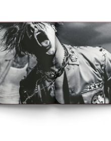 Book cover of All My Friends Have Deserted: Photos of Yungblud by Tom Pallant, with a Promo shot of Yungblud in bold makeup pouting at camera, resting his hands under chin. Published by ACC Art Books.