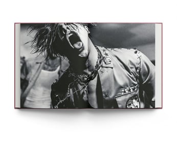Book cover of All My Friends Have Deserted: Photos of Yungblud by Tom Pallant, with a Promo shot of Yungblud in bold makeup pouting at camera, resting his hands under chin. Published by ACC Art Books.