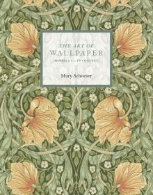Decorative wallpaper design in green blue and yellow featuring peony like flowers with Morris & Co. The Art of Wallpapers from The Sanderson Archive in white by ACC Art Books
