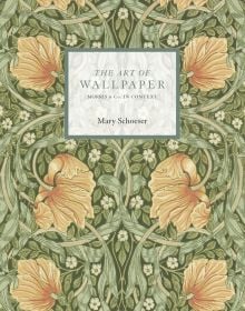 Book cover of Mary Schoeser's The Art of Wallpaper: Morris & Co. in Context, with Morris Pimpernel Bayleaf/Manilla wallpaper design. Published by ACC Art Books.