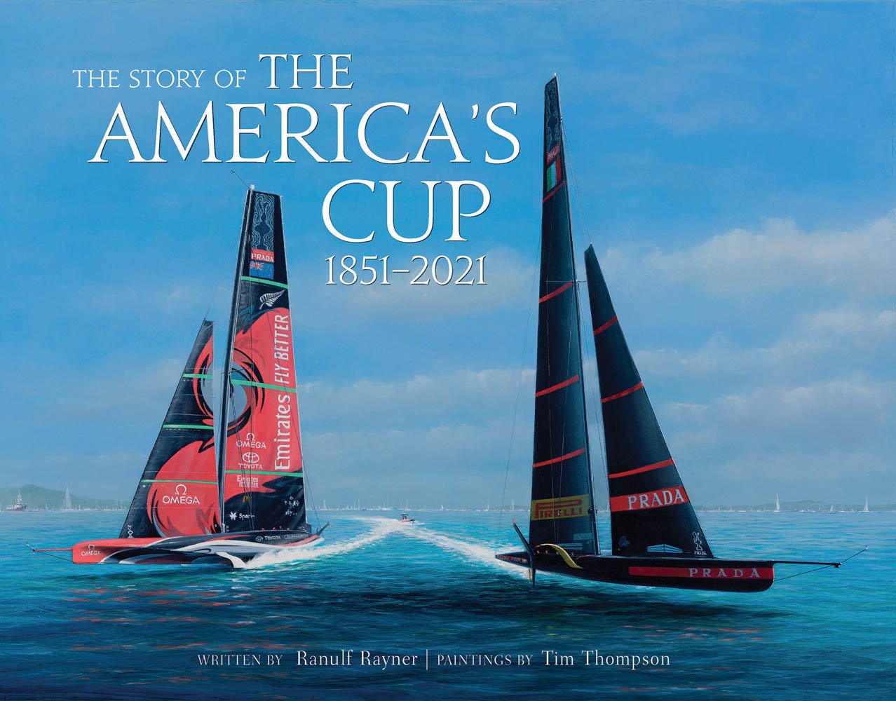 Two large yachts in a race on the ocean, under blue sky, on cover of 'The Story of the America's Cup, 1851-2021', by ACC Art Books.